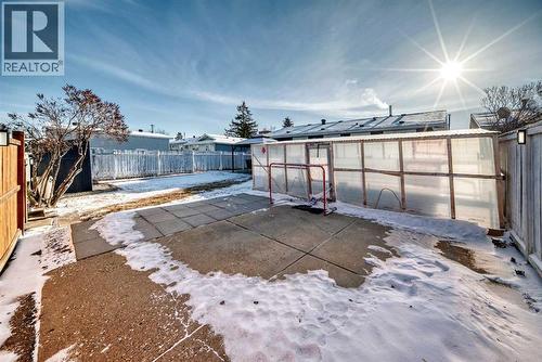 Concrete parking pad could become personal basketball court - 216 Pinecrest Crescent Ne, Calgary, AB - Outdoor