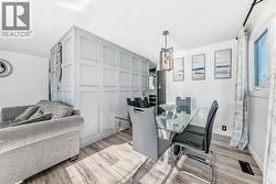 Dining room with feature wall connects to the kitchen - 