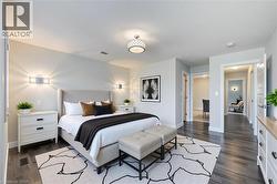 Bedroom featuring dark wood-style floors - 