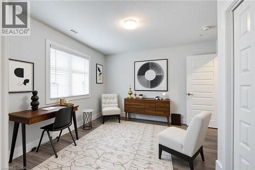 Office featuring light wood-type flooring and a textured ceiling - 2527 Holbrook Drive, London, ON - Indoor