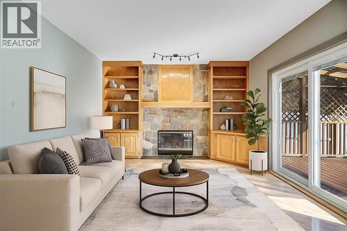107 Wood Valley Drive Sw, Calgary, AB - Indoor Photo Showing Living Room With Fireplace