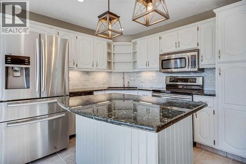 107 Wood Valley Drive Sw, Calgary, AB - Indoor Photo Showing Kitchen With Stainless Steel Kitchen With Upgraded Kitchen