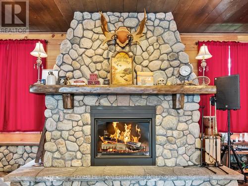 1326 Kawagama Lake Road, Algonquin Highlands (Sherborne), ON - Indoor Photo Showing Living Room With Fireplace