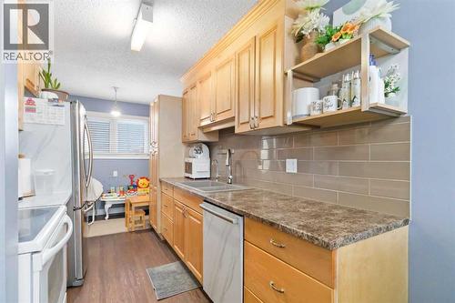 109 Ross Street, Fort Mcmurray, AB - Indoor Photo Showing Kitchen With Double Sink
