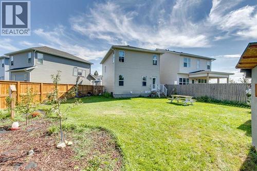 Summer Time Backyard - 43 Sunrise Crescent Ne, High River, AB - Outdoor With Exterior