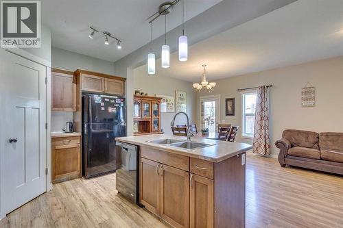 43 Sunrise Crescent Ne, High River, AB - Indoor Photo Showing Kitchen With Double Sink