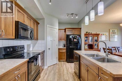 43 Sunrise Crescent Ne, High River, AB - Indoor Photo Showing Kitchen With Double Sink