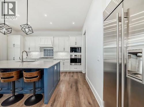 60 Junegrass Terrace, Rural Rocky View County, AB - Indoor Photo Showing Kitchen With Upgraded Kitchen