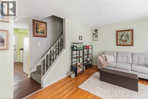Living room with wood finished floors and stairway - 48 Riverdale Drive Unit# 2, Hamilton, ON - Indoor Photo Showing Living Room