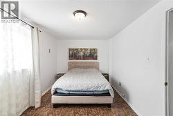 Bedroom featuring baseboards - 
