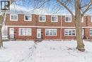 View of front of home featuring mansard roof, roof with shingles, and brick siding - 48 Riverdale Drive Unit# 2, Hamilton, ON  - Outdoor With Facade 