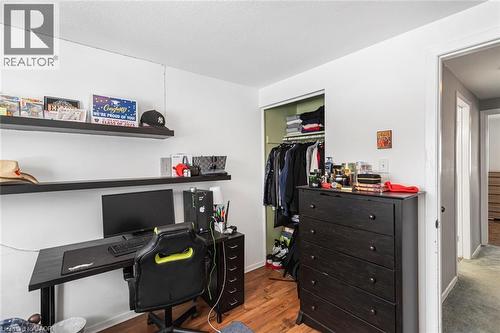 Office area with dark wood finished floors and baseboards - 48 Riverdale Drive Unit# 2, Hamilton, ON - Indoor Photo Showing Office