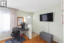 Office area featuring light wood finished floors and baseboards - 