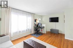 Office area with light wood-style floors and baseboards - 