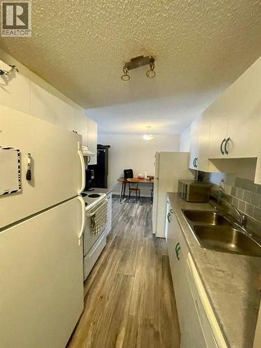 205A, 5611 10 Avenue, Edson, AB - Indoor Photo Showing Kitchen With Double Sink