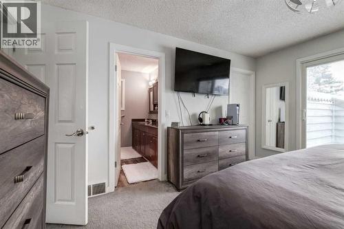 16 Woodgate Close Sw, Calgary, AB - Indoor Photo Showing Bedroom