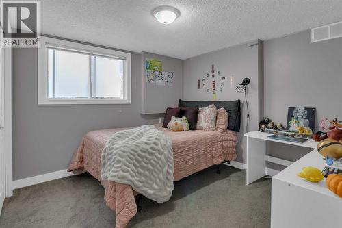 BEDROOM 3 - 40 Hunters Gate, Okotoks, AB - Indoor Photo Showing Bedroom