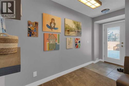 WALK OUT ENTRANCE - 40 Hunters Gate, Okotoks, AB - Indoor Photo Showing Other Room