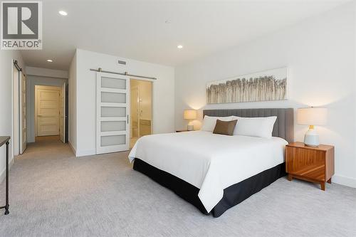 Primary Bedroom - 102, 101A Stewart Creek Rise, Canmore, AB - Indoor Photo Showing Bedroom