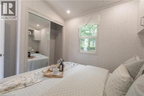 Bedroom featuring lofted ceiling, a closet, recessed lighting, and ornamental molding - 85 Hutchinson Beach Road Unit# B56, Huntsville, ON - Indoor Photo Showing Bedroom