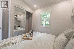 Bedroom featuring lofted ceiling, a closet, recessed lighting, and ornamental molding - 