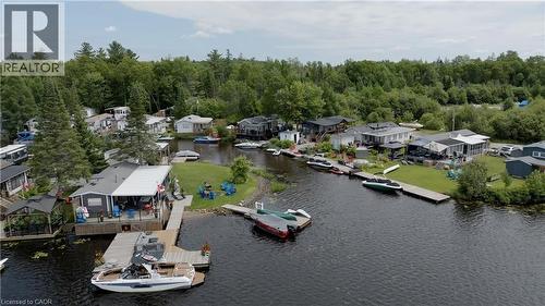 Aerial perspective of suburban area featuring a large body of water - 85 Hutchinson Beach Road Unit# B56, Huntsville, ON - Outdoor With Body Of Water With View