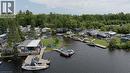 Aerial perspective of suburban area featuring a large body of water - 85 Hutchinson Beach Road Unit# B56, Huntsville, ON  - Outdoor With Body Of Water With View 