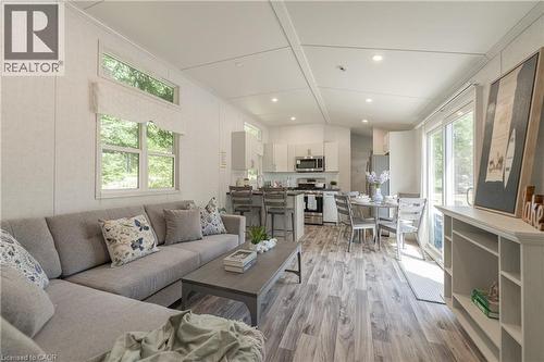 Living room with light wood-type flooring and recessed lighting - 85 Hutchinson Beach Road Unit# B56, Huntsville, ON - Indoor Photo Showing Living Room