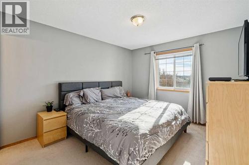 56 West Terrace Road, Cochrane, AB - Indoor Photo Showing Bedroom