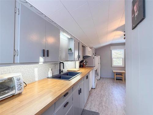 310 Commercial Street, Wawanesa, MB - Indoor Photo Showing Kitchen With Double Sink