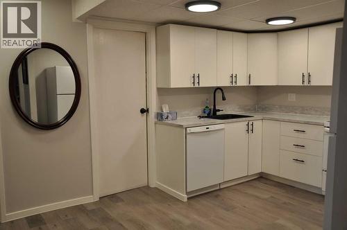 kitchen with entrance into laundry room - 134, 1237 4 Avenue S, Lethbridge, AB - Indoor