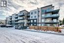 316, 200 Shawnee Square Sw, Calgary, AB  - Outdoor With Balcony With Facade 
