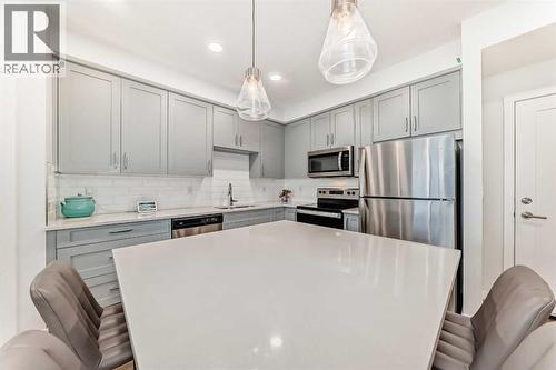 316, 200 Shawnee Square Sw, Calgary, AB - Indoor Photo Showing Kitchen With Stainless Steel Kitchen With Upgraded Kitchen