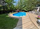 View of pool with a wooden deck and an outdoor structure - 5119 Cherryhill Crescent, Burlington, ON  - Outdoor With In Ground Pool With Deck Patio Veranda With Backyard 