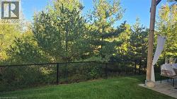 View of yard backing onto more greenspace - 