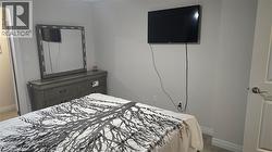 Bedroom featuring walk-in closet with window - 