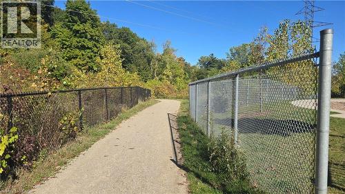Trails with a wooded view behind exclusive Playground - 115 South Creek Drive Unit# 15D, Kitchener, ON - Outdoor