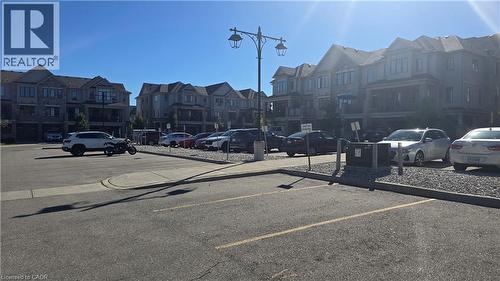 Parking lot featuring a residential view - 115 South Creek Drive Unit# 15D, Kitchener, ON - Outdoor