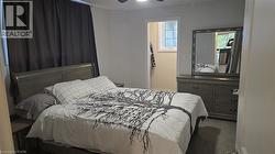 Bedroom with carpet,  a ceiling fan and walk-in closet with window - 