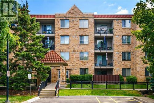 3499 Upper Middle Road Unit# 211, Burlington, ON - Outdoor With Balcony With Facade