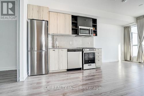 808 - 10 De Boers Drive, Toronto, ON - Indoor Photo Showing Kitchen With Stainless Steel Kitchen