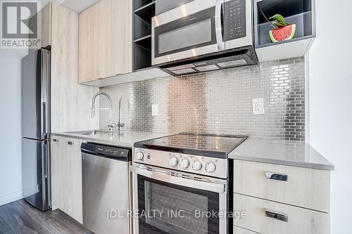 808 - 10 De Boers Drive, Toronto, ON - Indoor Photo Showing Kitchen With Upgraded Kitchen