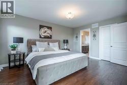 Elegant Primary Bedroom with double door entry, ensuite bath and walk-in closet - 