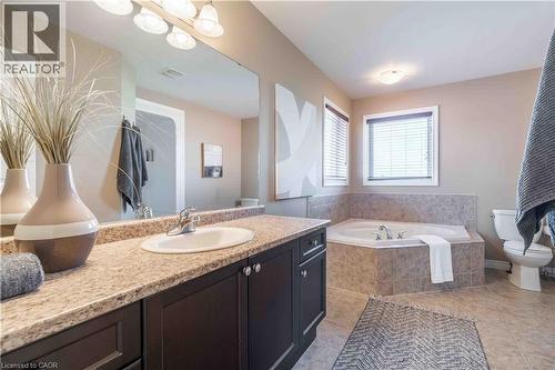 Ensuite Bathroom featuring vanity, a bath, toilet and shower stall and light tile patterned flooring - 51 Showcase Drive, Hamilton, ON - Indoor Photo Showing Bathroom