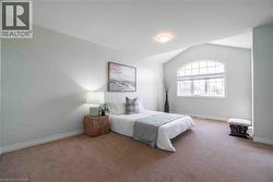Soaring ceiling with huge window create a welcoming bedroom. - 