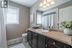 B4 pc bathroom with vanity and light tile patterned flooring - 