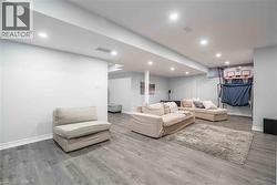 recessed lighting and wood finished floors - 