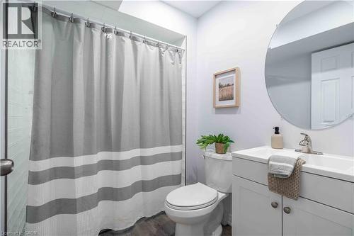 3 pc Bathroom with vanity, a shower with curtain, and dark wood-style floors - 51 Showcase Drive, Hamilton, ON - Indoor Photo Showing Bathroom