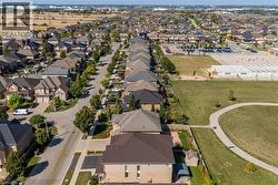 Aerial view of property and surrounding area featuring nearby school area - 