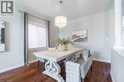 Columns, half wall and large window plus engineered hardwood floors add to the ambiance of this space - 